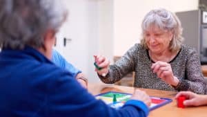Seniors playing at old care facility.